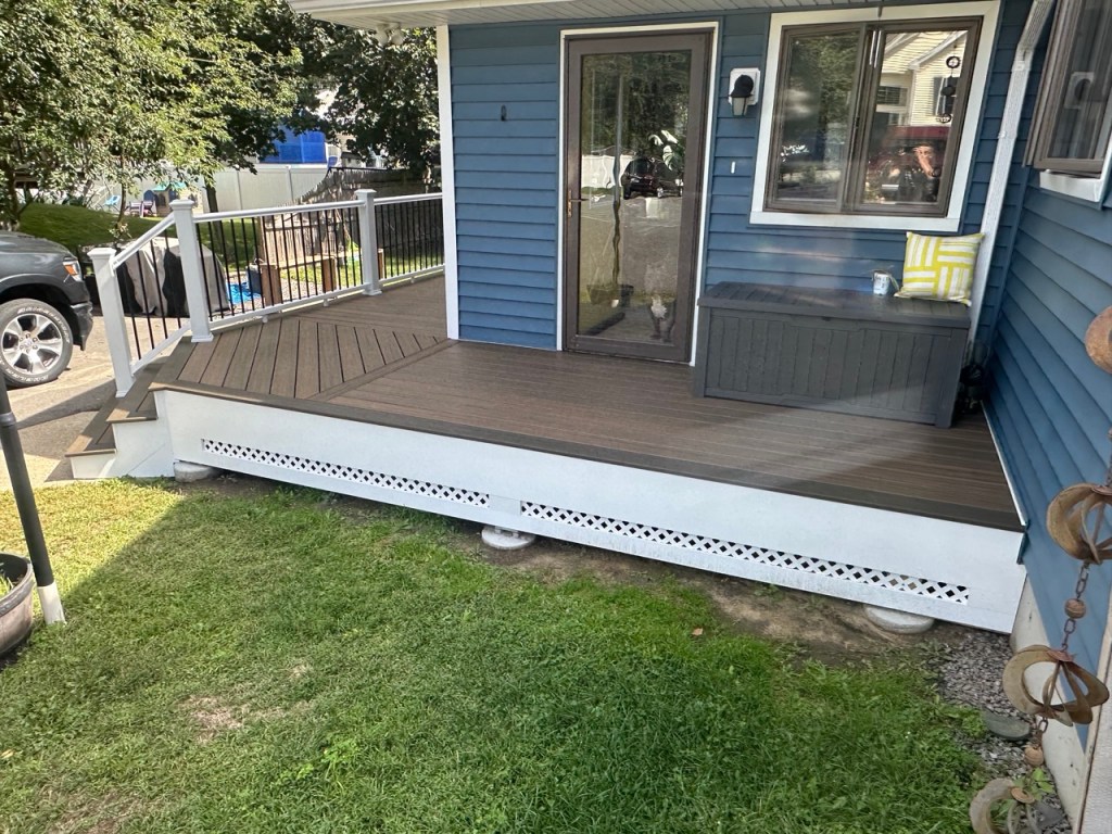 side of deck with blue house